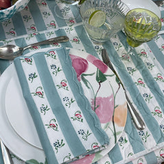 Details of scalloped napkins of the aqua stripes and ruffled hand block printed table cloth collection made for The Charpoy.