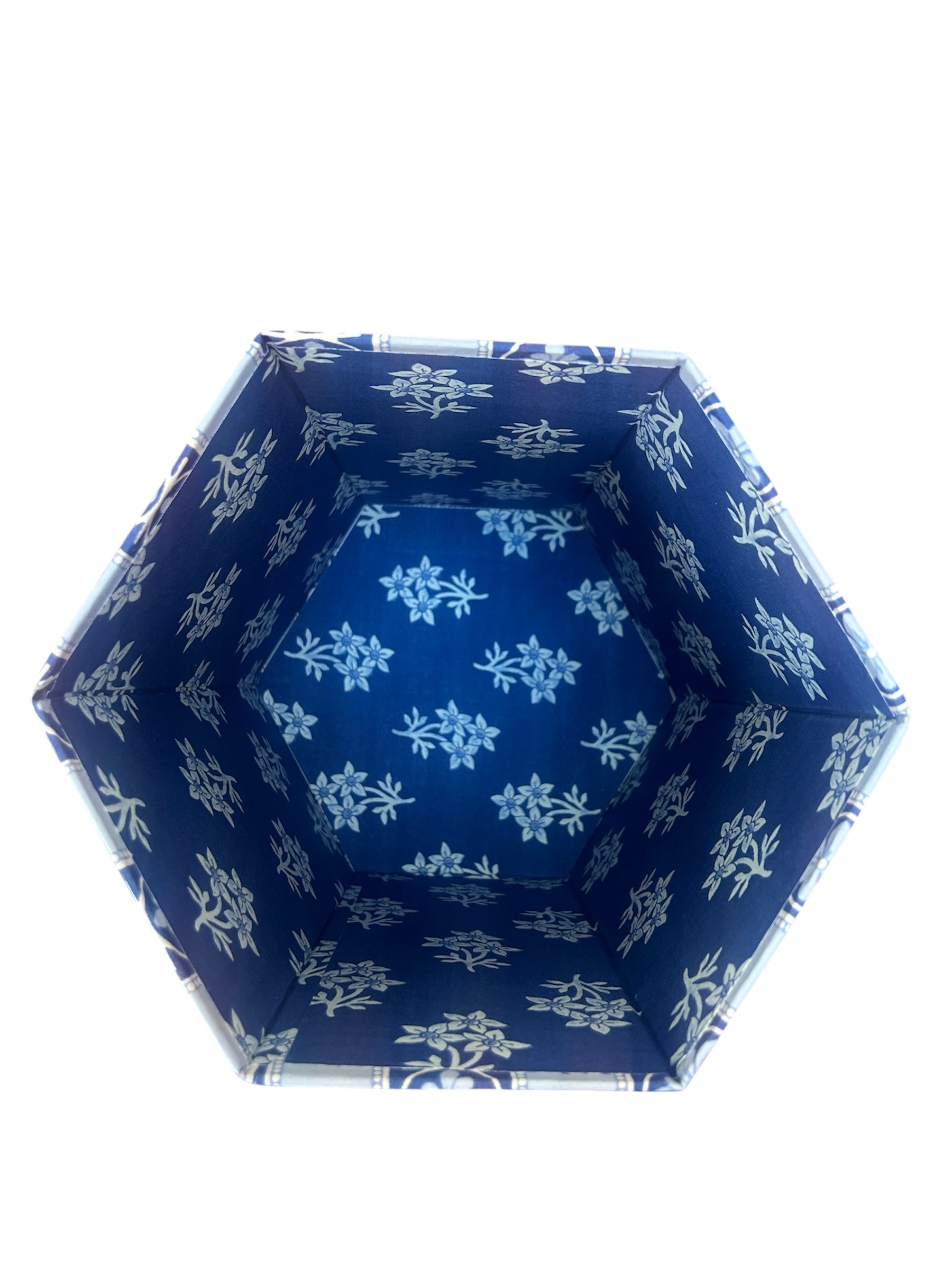 Birds eye view into the Blue flower stripe hand block Printed waste paper bin handcrafted from 100% recycled cardboard by skilled artisans in Jaipur by The Charpoy on a white background with floral details showing it Hexagonal shape.