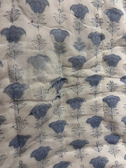 Floral patterned fabric with blue flowers on a beige background The Charpoy