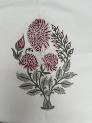 Embroidered design of flowers and leaves on a white fabric background The Charpoy