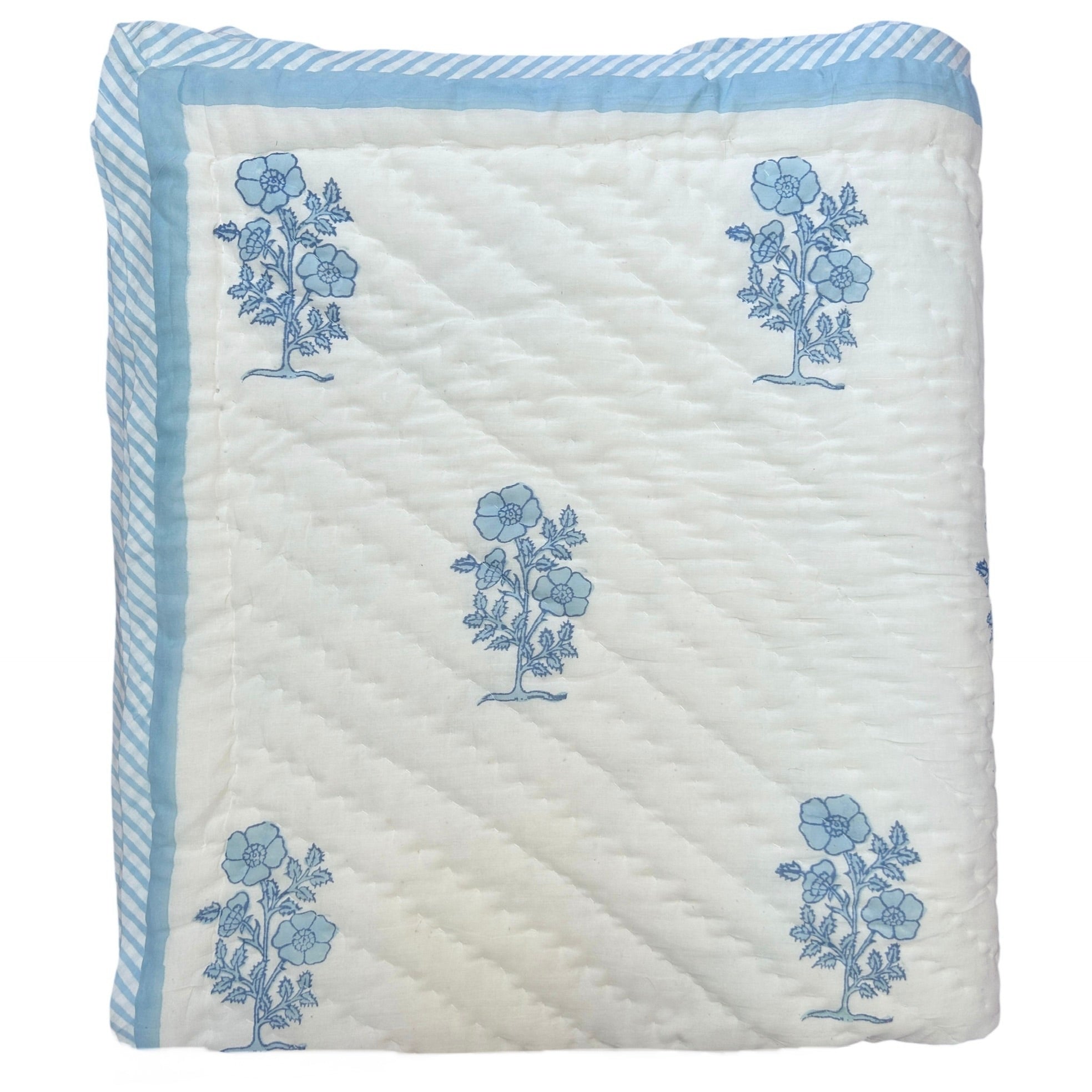 Hand block printed Quilt with blue floral patterns on a white background |The Charpoy