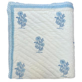 Hand block printed Quilt with blue floral patterns on a white background |The Charpoy