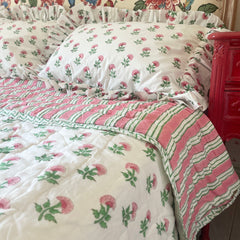 Pink And Green Carnation Hand Block Printed Quilt with matching pillow covers in single, king and super king sizes. handcrafted in Jaipur by The Charpoy