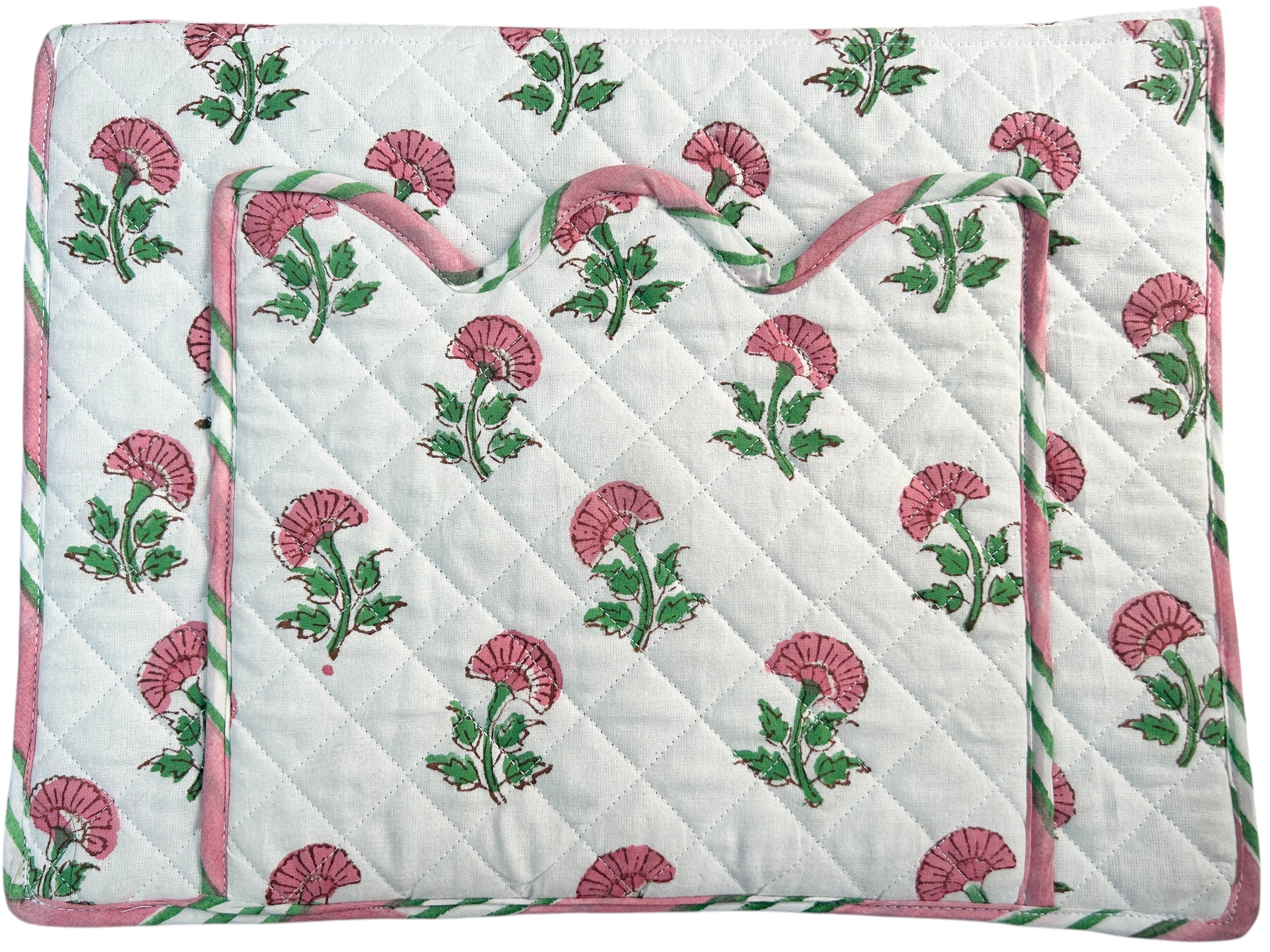 Floral-patterned laptop cover with pink and green flowers on a white background. The Charpoy