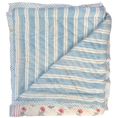 Reverse of pink and blue carnation hand block printed quilt showing blue and white striped pattern by The Charpoy