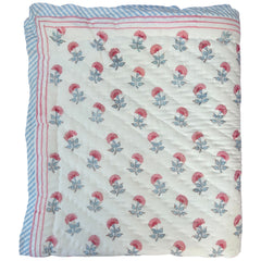 Pink and blue carnation hand block printed cotton quilt by The Charpoy on a white background