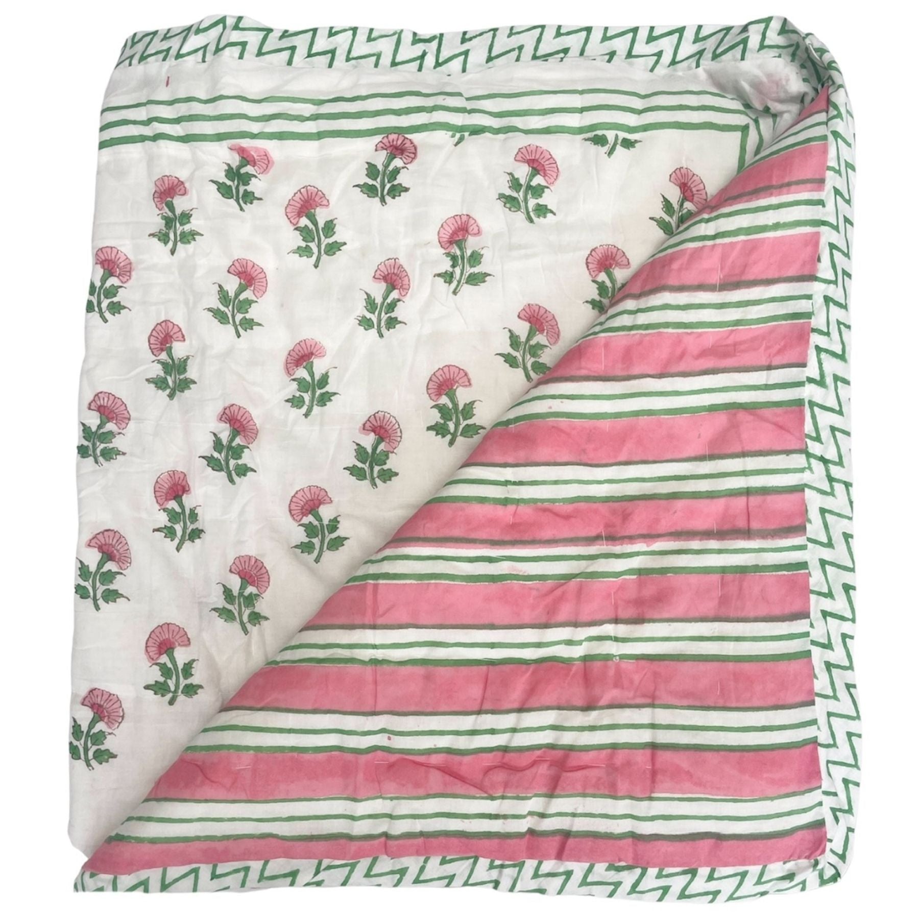 Pink and green carnation hand block printed quilt with pink and green stripes on the reverse by The Charpoy