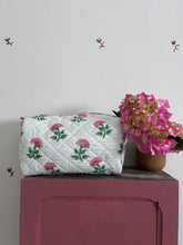 Pink And Green Flower Quilted Wash Bag hand block printed and lightly quilted by artisans in Jaipur by The Charpoy in a bathroom