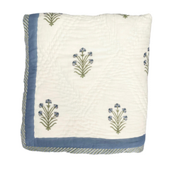 Close up of the blue buta hand block printed cotton quilt with floral motifs, handmade in Jaipur by The Charpoy