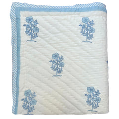 Hand block printed Quilt with blue floral patterns on a white background |The Charpoy 