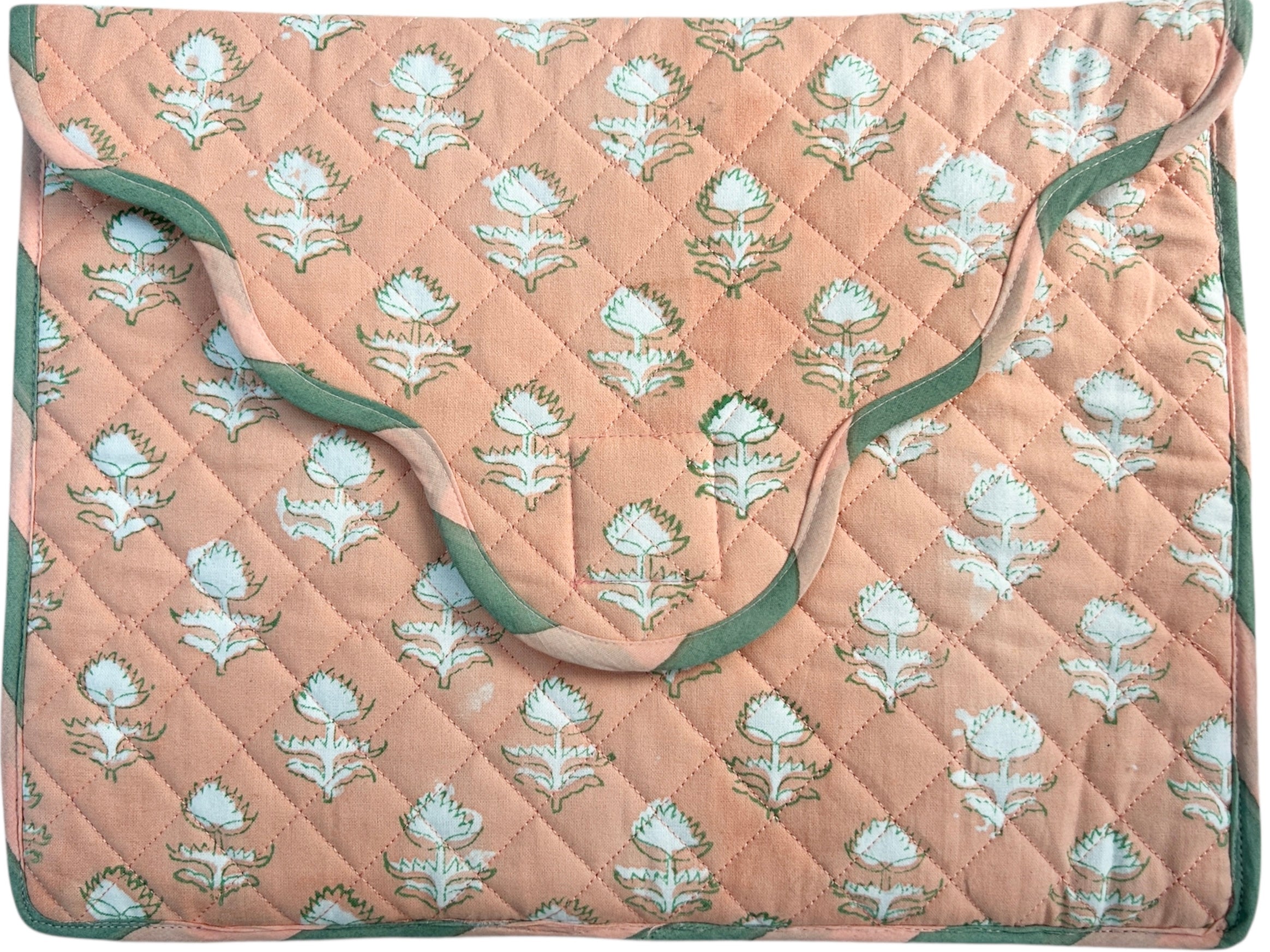 Quilted laptop cover with floral pattern on a peach background The Charpoy 