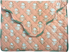 Quilted laptop cover with floral pattern on a peach background The Charpoy 