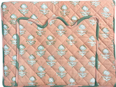 Quilted laptop cover with floral pattern on a peach background The Charpoy 