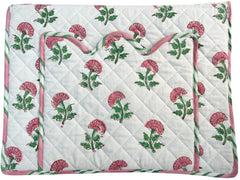 Floral-patterned laptop cover with pink and green flowers on a white background. The Charpoy
