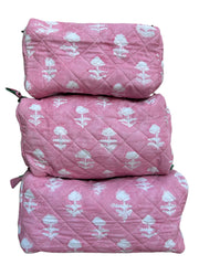 Set of three pink quilted wash bags with white floral patterns on a white background The Charpoy