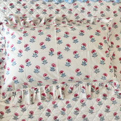 Floral patterned fabric with pink flowers pillow covers on a white background The Charpoy