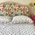 Pink And Green Carnation Hand Block Printed Quilt with matching pillows in single, king and super king sizes. handcrafted in Jaipur by The Charpoy