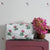 Pink And Green Flower Quilted Wash Bag hand block printed and lightly quilted by artisans in Jaipur by The Charpoy in a bathroom