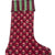 Red floral-patterned Christmas stocking with green trim on a white background