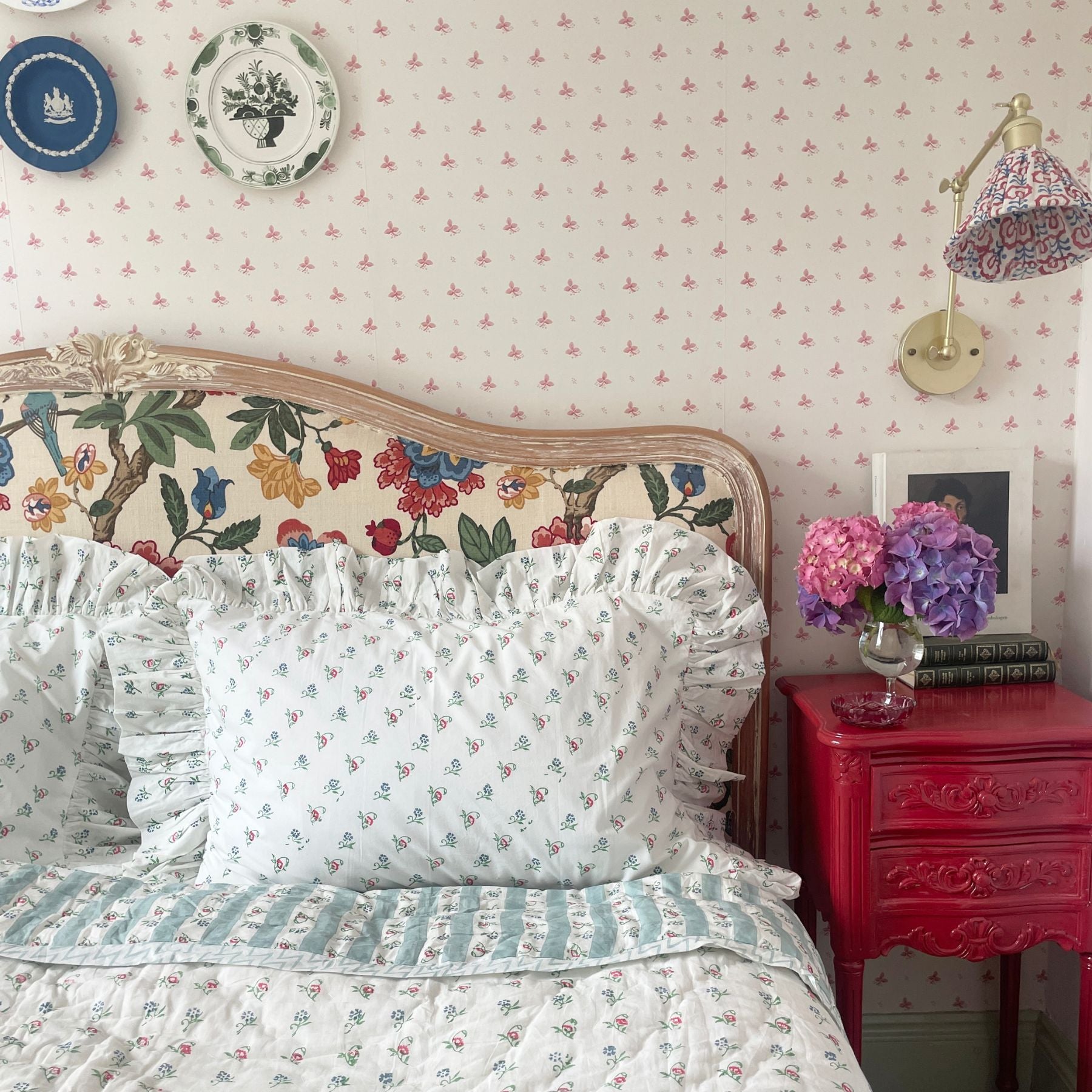 Wild Flowers Hand Block Printed Quilt  styled on a bed with matching pillow, handcrafted in Jaipur by The Charpoy 