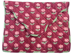 Quilted fabric laptop cover with floral pattern on a red background The Charpoy 